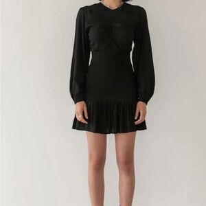 Trois the Label’s Rue dress Long-Sleeve Smocked Waist Ruffle Hem Mini Dress